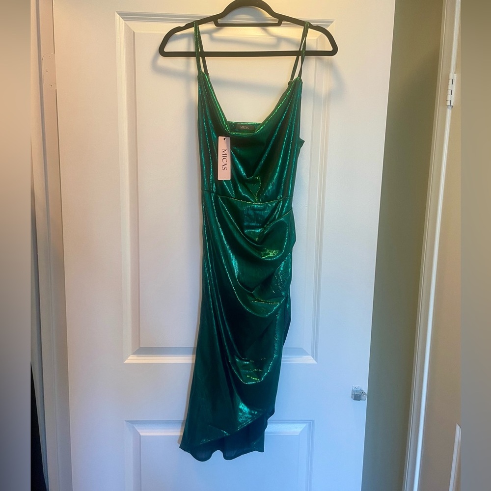 Metallic green dress with tags still on it. Size large.